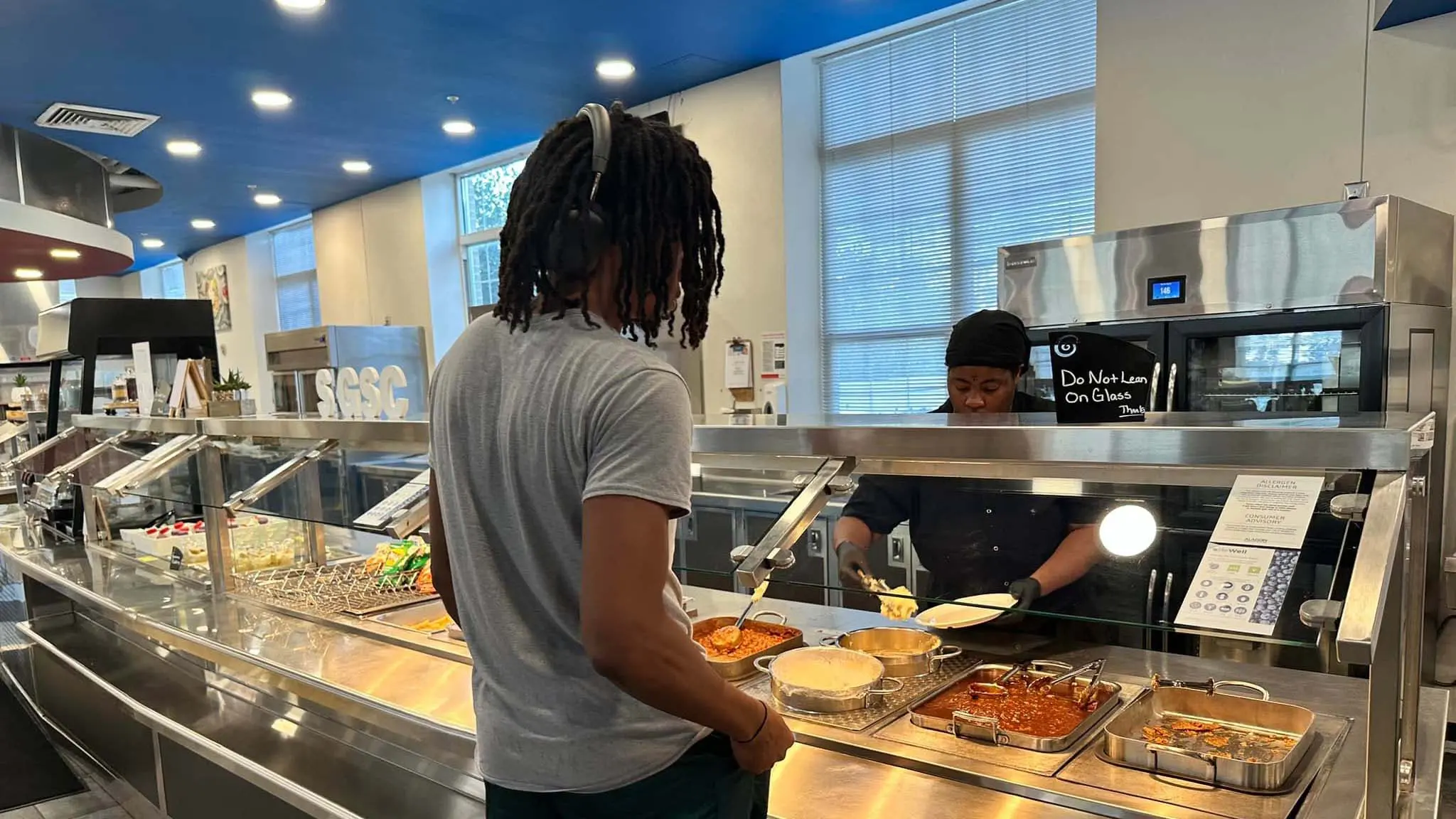 Student waiting in line to be served in dining hall